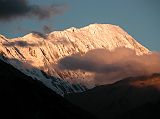 Annapurna 13 03 Grande Barriere Sunrise From Manang The Grande Barri�re shone in the morning sun from Manang. This 10km long wall of rock, ice and snow was named by Maurice Herzog in 1950. The highest portion of the Grande Barriere at the far right is called Tilicho Peak (7134m), which was first climbed via the northwest shoulder on October 10, 1978 by Emmanuel Schmutz of France.